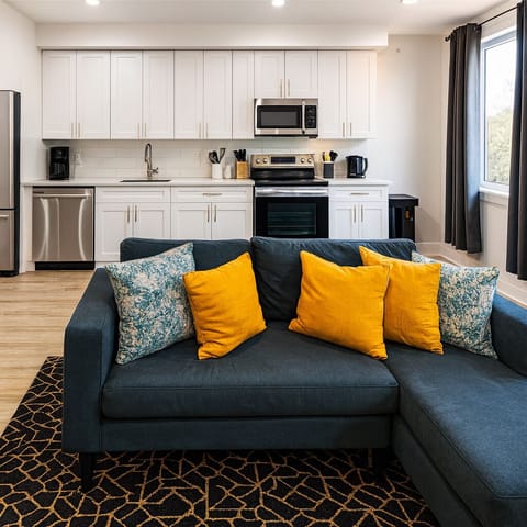 Modern living room with a comfy sofa and smart TV for movie nights.
