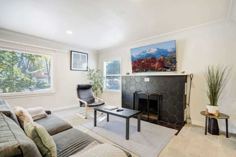 Kick back in the bright living room with comfy seating and a fireplace that sets the tone for relaxed nights in.