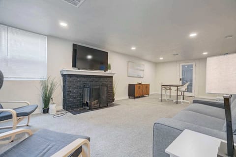 Gather in the sunlit lounge with a sleek fireplace and TV—an easy spot to unwind between adventures.