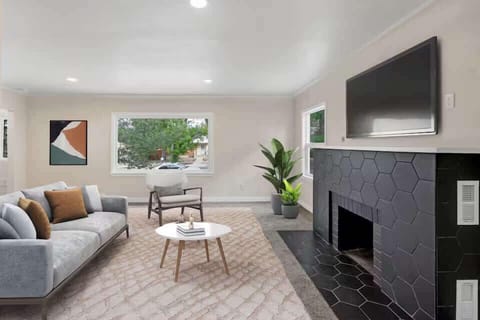Settle into the second lounge with comfy seating, a fireplace, and a TV—an easy spot for movie nights and slow mornings.