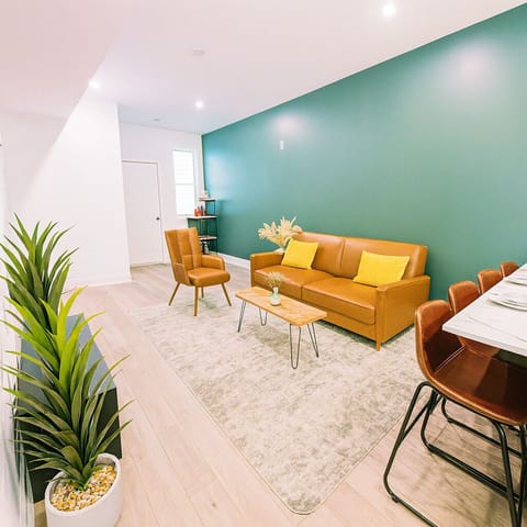 Cozy ambiance enhanced by warm lighting and contemporary artwork.