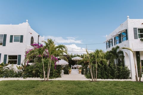 A view of the main home and rear cottage from across the lawn, illustrating how spacious and peaceful our grounds are.