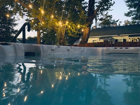 Evenings at The Hourglass Inn — unwind under the string lights in our heated swim spa ✨