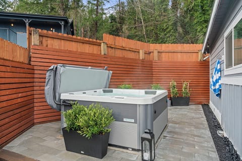 Hot Tub Daytime – Soothing hot tub surrounded by privacy fence