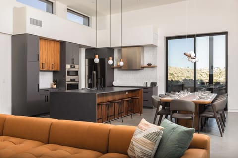 5-burner induction range, double oven, built-in fridge, 10 chars, 4 stools.