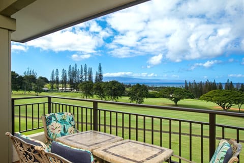 Sip your morning brew or sunset cocktail on this charming lanai—where the golf greens glow and skies stretch forever KGV-17V3