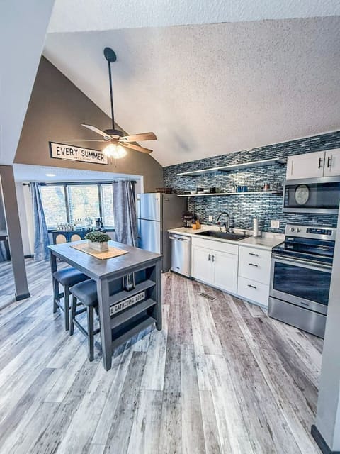 Fully equipped kitchen with stainless steel appliances.