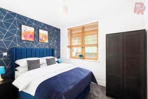 Rest easy in the spacious and serene primary bedroom.