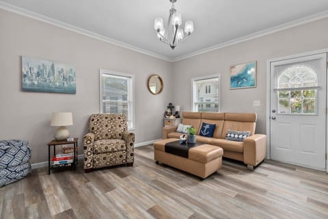 A bright, airy space designed for conversation, reading, or a cozy movie night.