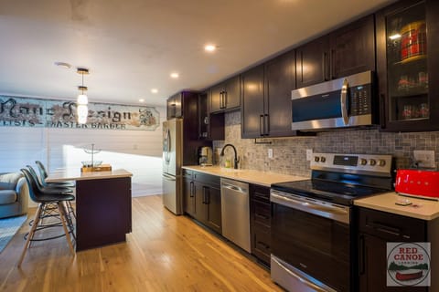 Bright kitchen design blending functionality with contemporary style and warm, welcoming tones.