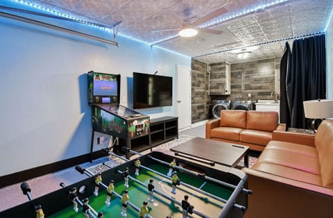 The game room is a hit with families and groups, featuring a flat-screen TV, PlayStation 5, and classic pinball machine for hours of entertainment and relaxation.