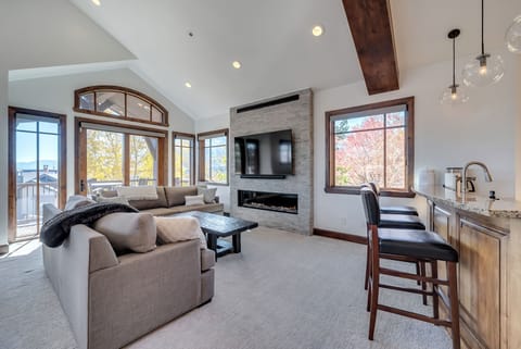 Spacious great room with gas fireplace, Sonos, and Uinta Mountain View’s