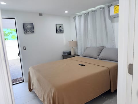 Queen bedroom 2 -Step into your peaceful bedroom sanctuary where crisp linens and gentle natural light create the perfect retreat. Relax in your comfortable bed while enjoying views of the sunny patio beyond.  Closet to the right of bed