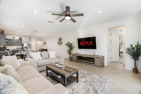 Bright,modern living room with open layout and smart TV"