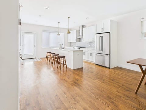 Open, airy layout with a large center island — perfect for family breakfasts or hosting friends.