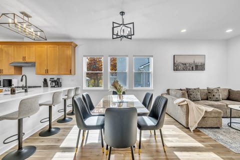 Spacious open layout featuring a cozy living area, dining space, and fully equipped kitchen