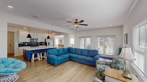 The living area blends seamlessly into the dining area and kitchen, creating a centralized gathering spot for cooking, eating, and entertaining. It's the perfect blend of comfort and functionality.