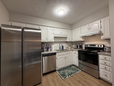 Fully equipped kitchen with appliances.