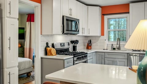 Open, bright, and ready to serve—our kitchen is basically an invitation to gather, laugh, and eat your way through vacation.