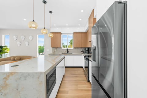 Fully equipped modern kitchen with stainless steel appliances and plenty of space to whip up your favorite island-inspired meals.