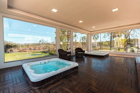Soak in bubbling hot tubs while sunlight pours in.