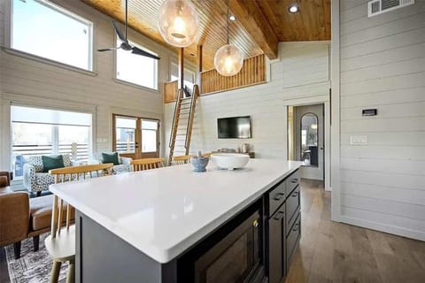 Bright kitchen island overlooking cozy living area 