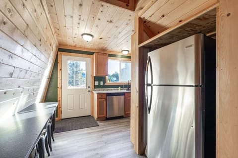 Full kitchen, backdoor goes out to hot tub.