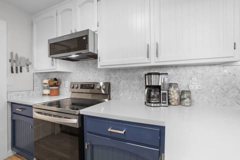 Stainless steel appliances and an electric stove top