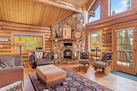 Living Room (main floor): Wood-burning fireplace (firewood not provided.), vaulted ceilings, Smart TV