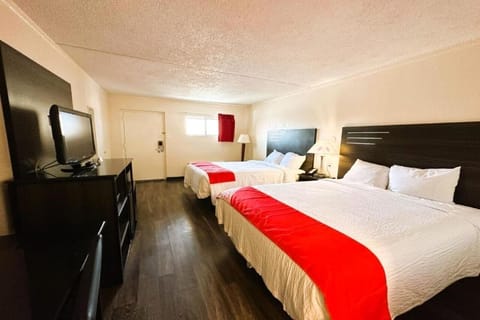 Bedroom, TV, mini fridge, and a microwave