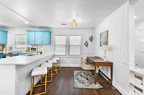 Fully renovated and fully equipped kitchen featuring elegant marble countertops and spacious cabinets to accommodate all your family's needs. Plus, a dedicated workstation for a seamless workcation experience.