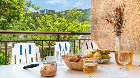 Inviting terrace table set for an al fresco breakfast with mountain views.