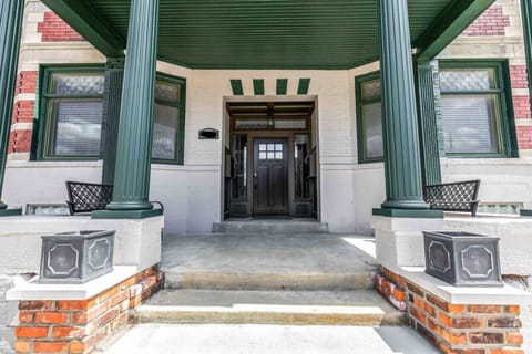 Front porch of building with benches for seating and smart lock access.