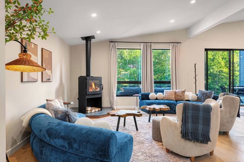 Comfortable living room with a wood-burning fireplace — a favorite spot for morning coffee.
