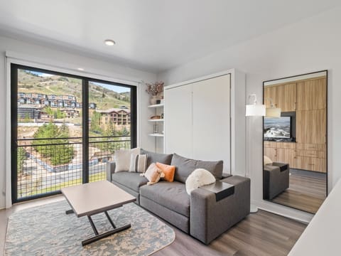 Studio living area with queen Murphy bed