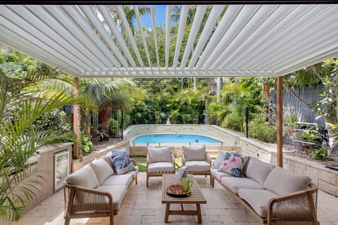 Outdoor entertaining area with BBA/grill/small fridge, sink.