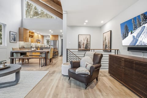 Spacious great room with modern alpine style and natural light