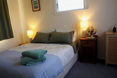 Comfy Queen Bed in large bedroom
