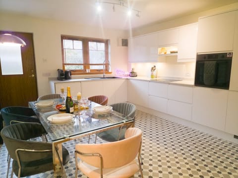 Open kitchen-dining layout ideal for relaxed meals or morning coffee together.