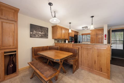 Your spacious kitchen features warm wood cabinetry and a cozy breakfast nook where you'll enjoy morning coffee together.