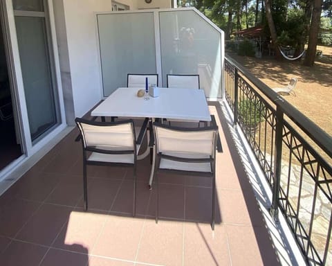 Shaded outdoor seating area with a gentle sea breeze — your personal haven for reading, relaxing, or evening chats.