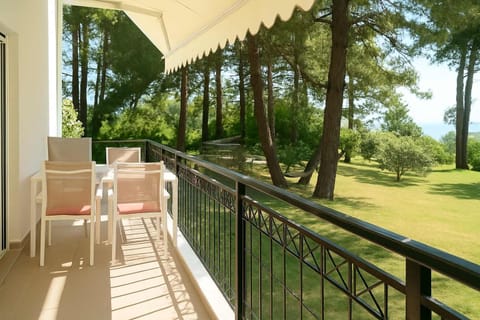 Enjoy breakfast or an evening drink on your private balcony surrounded by pines