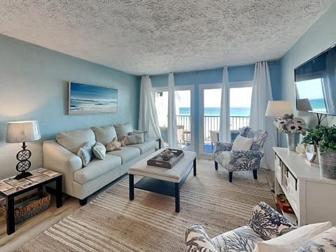 Open concept living area with stylish furnishings and gulf views