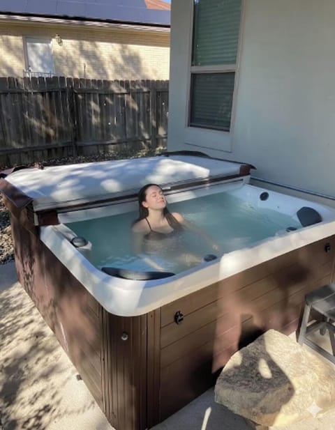 Soak and relax in the private hot tub. 