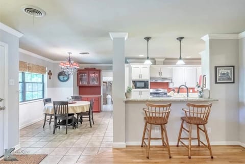 Enjoy family meals together in our cozy dining area, perfect for savoring unforgettable moments with your loved ones.