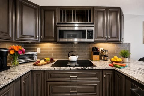 Kitchen w/ Microwave and Electric Stove Top