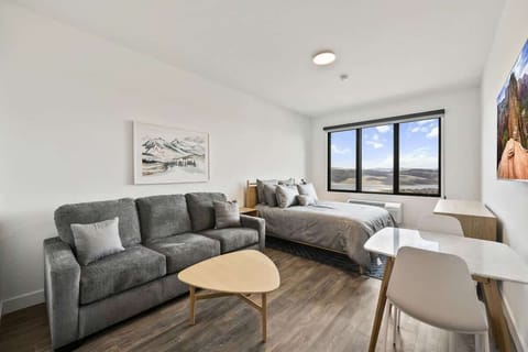 Cozy studio with mountain views, modern furnishings, and a bright open layout