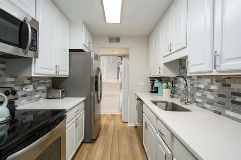Bright modern kitchen with stainless steel appliances