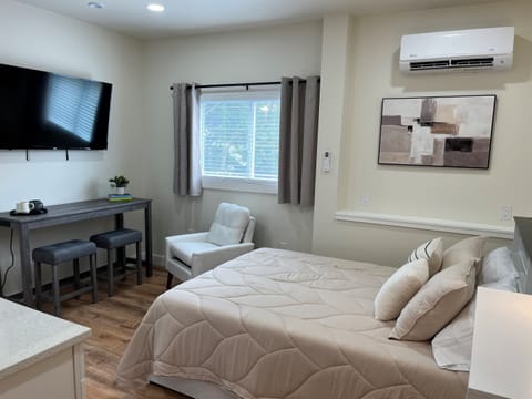 Queen bed in studio sleeping area