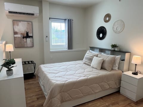 Queen bed in studio sleeping area